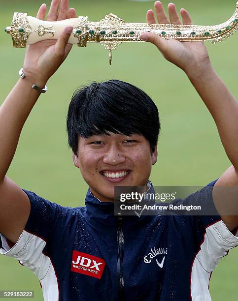 Jeunghun Wang of Korea poses with the dagger trophy after winning the Trophee Hassan II at Royal Golf Dar Es Salam on May 8, 2016 in Rabat, Morocco.