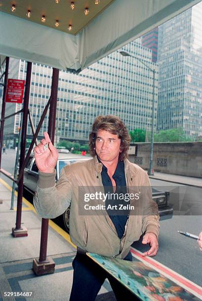 Michael Landon wearing a beige leather jacket, on the street ; circa 1990; New York.