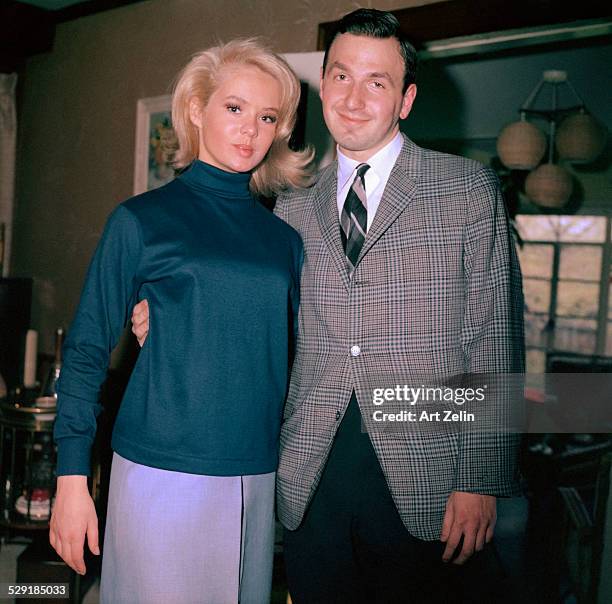 Joey Heatherton and Art Zelin. In her home. Rockville Centre, Long Island, NY. Joey Heatherton's mother took the photo.; circa 1960 ; New York.