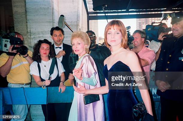 Kelly Curtis with her mother Janet Leigh on the red carpet with photographer is in the background; circa 1990; New York.