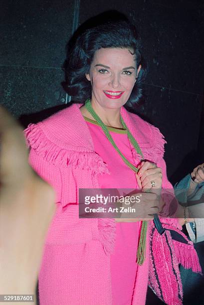 Jane Russell wearing pink with green beads; circa 1970; New York.