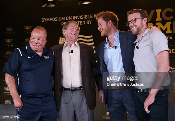 Prince Harry, Former President George W Bush Royal Marine veteran JJ Chalmers and Air Force Technical Sgt. Israel Del Toro talk at a Symposium of...