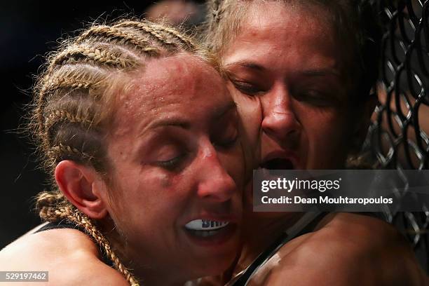 Karolina Kowalkiewicz of Poland and Heather Jo Clark of the USA compete in their Women's Strawweight bout during the UFC Fight Night 87 at Ahoy on...