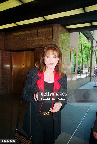 Jackie Collins posing for the photographer; circa 1990; New York.