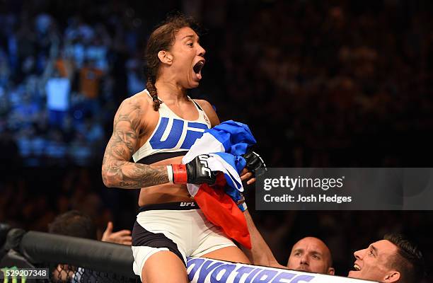 Germaine de Randamie celebrates her victory over Anna Elmose in their women's bantamweight bout during the UFC Fight Night event at Ahoy Rotterdam on...