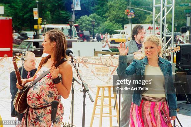 Natalie Maines and Emily Robinson, of The Dixie Chicks, in performance ; circa 1990; New York.