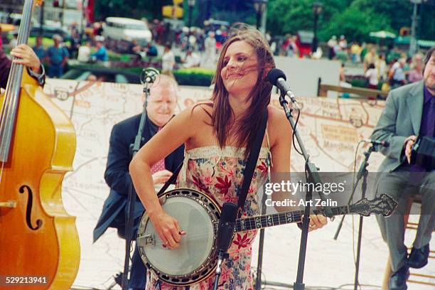 Emily Robinson, of The Dixie Chicks, playing the banjo ; circa 1990; New York.