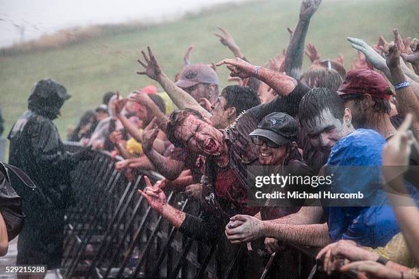 Crowd gets covered in fake blood and rain durng Riot Fest in Toronto, Ontario