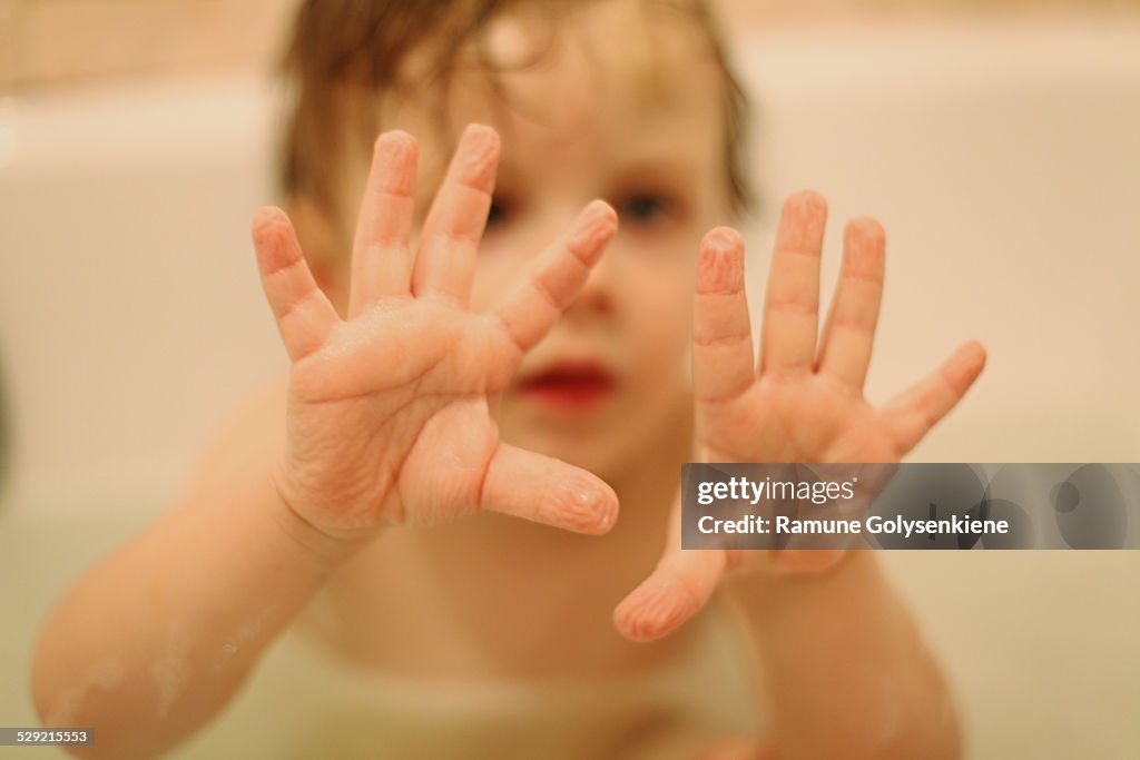 Child's wrinkled palms after a warm bath