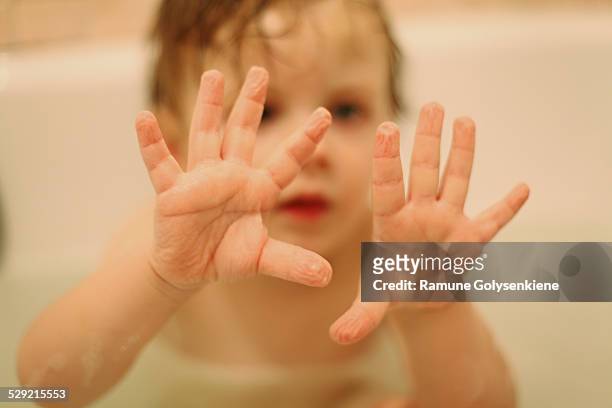 child's wrinkled palms after a warm bath - wrinkled imagens e fotografias de stock
