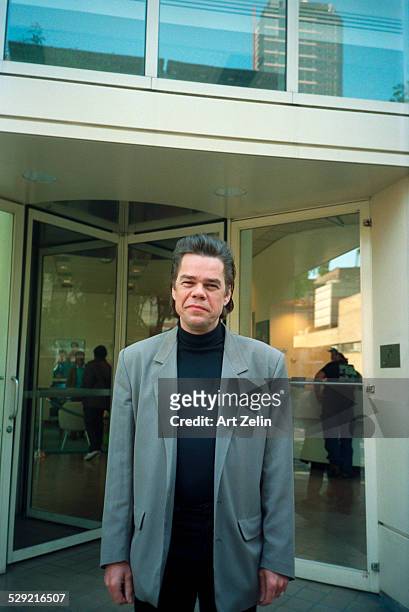 David Johansen wearing a gray jacket, posing on the street ; circa 1990; New York.