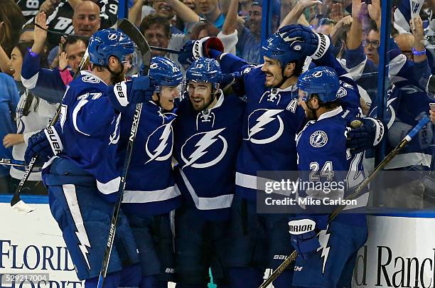 Victor Hedman, Matt Carle,Cedric Paquette and Ryan Callahan celebrate a goal by Brian Boyle of the Tampa Bay Lightning against the New York Islanders...