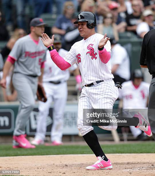 Avisail Garcia of the Chicago White Sox celebrates after reaching on a RBI double hit by Dioner Navarro during the seventh inning against the...