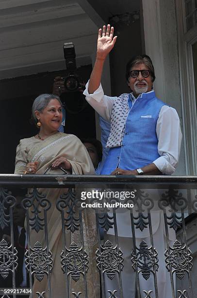 Amitabh Bachchan and wife Jaya wave to their fans from the balcony during the Kalyan Jewelle's new showroom inauguration ceremony in Kolkata, India,...