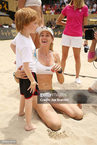 Kerri Walsh Jennings and son Sundance celebrate after winning the final match at the AVP Huntington Beach Open on May 08, 2016 in Huntington Beach,...