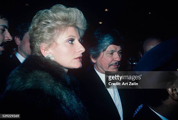 Charles Bronson with his wife Jill Ireland he is in a tux she is wearing a fur; circa 1970; New York.