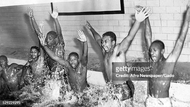 African American youth in a segregated swimming pool, Baltimore, Maryland, November 16 Original Caption Reads: 'These Enthusiatic Youngsters Were...