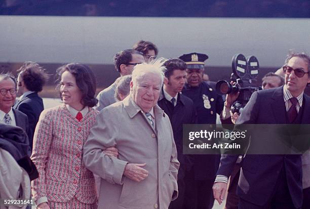 Charlie Chaplin with his wife Oona O'Neill arriving in NYC; circa 1970; New York.