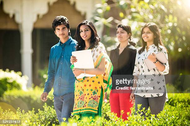 young indian students hanging out on campus - ethnicity stock pictures, royalty-free photos & images