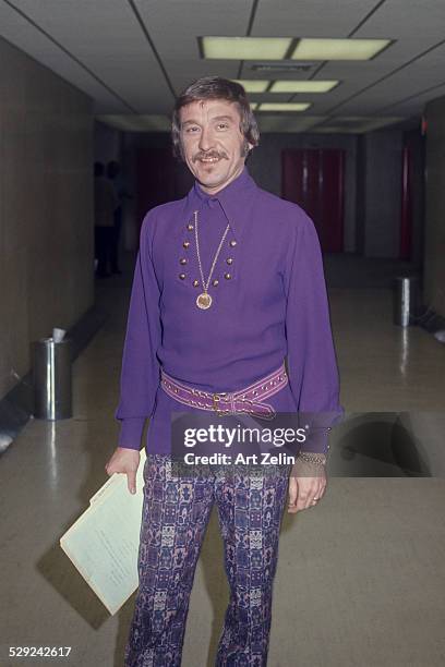 Doc Severinsen wearing a purple tunic and printed slacks; circa 1970; New York.