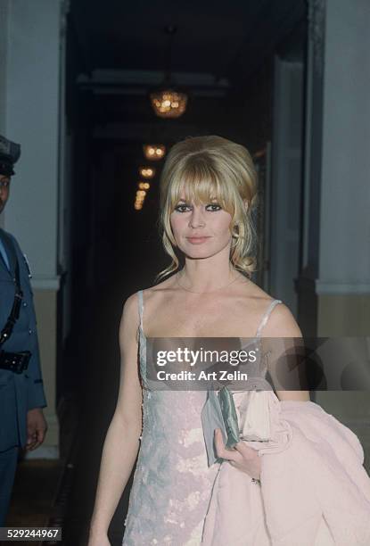 Brigitte Bardot wearing a white evening dress at the Plaza Hotel; circa 1970; New York.