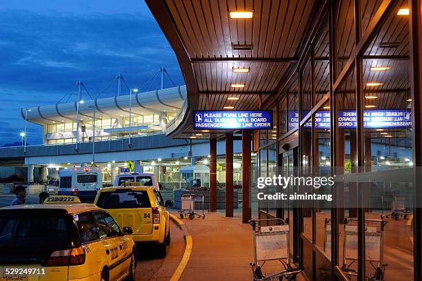 ted stevens anchorage international airport at night - anchorage airport stock pictures, royalty-free photos & images