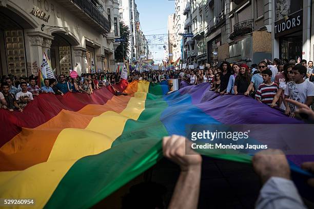Protesters unfurl a giant Gay Pride flag during the annual Trans-sexual march on Istanbul's Istiklal Caddesi on June 23rd, 2013. Istanbul's Pride...