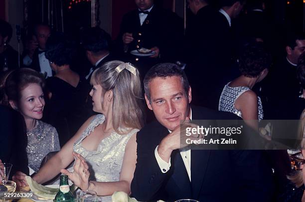 Paul Newman with is wife Joanne Woodward at a formal dinner; circa 1970; New York.
