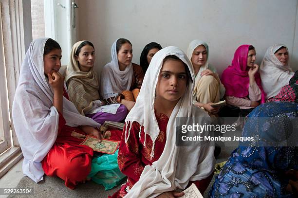 Girls learn to read and write at a Pashtun vocational school in Kabul, Afghanistan. The school is run as a vocational school, billed as a place for...