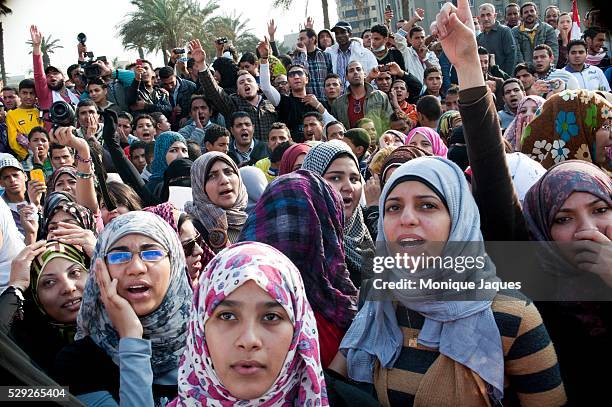 Women protest during the 6th day of protests in Cairo's Tahrir Square. A cease fire was set into effect early in the morning making the area free of...