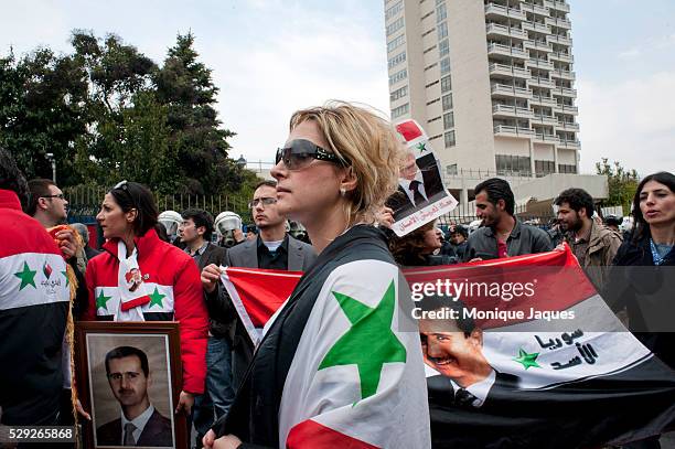 Demonstrators rally to show support of the Syrian goverment and president Bashar Al-Assad outside of the Second Friends of Syria meeting in Istanbul...