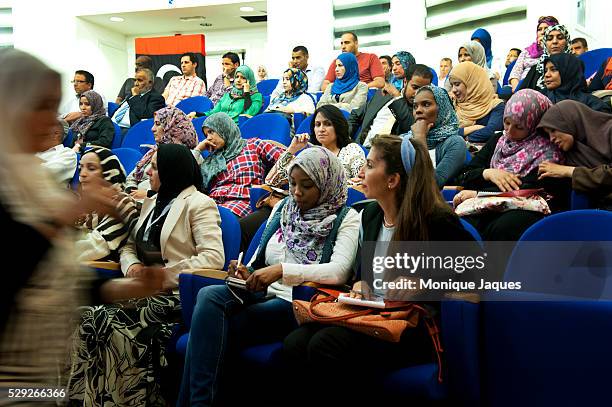 Women take notes during the Libyan International Women's Organization meeting in Tripoli on July 11th, 2012. 42 years after the reign of Col. Muammar...