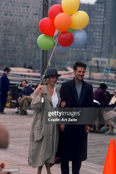 Mickey Rourke with Kim Basinger during the filming of "9 1/2 Weeks"; 1986; on Coney Island.