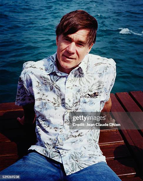 Gus Van Sant relaxes on a dock during the Cannes Film Festival.