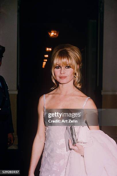 Brigitte Bardot wearing a white evening dress at the Plaza Hotel; circa 1970; New York.
