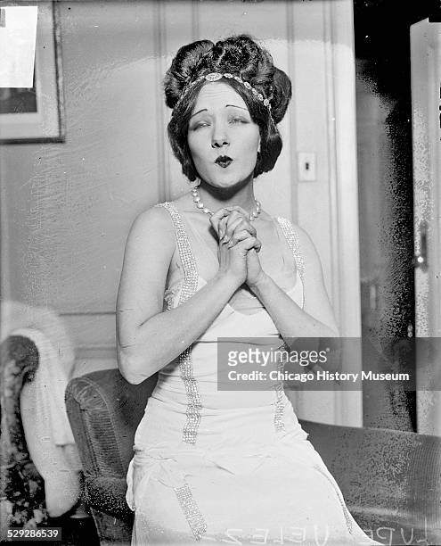 Actress Lupe Velez puckering her lips and closing her eyes, Chicago, Illinois, 1929.
