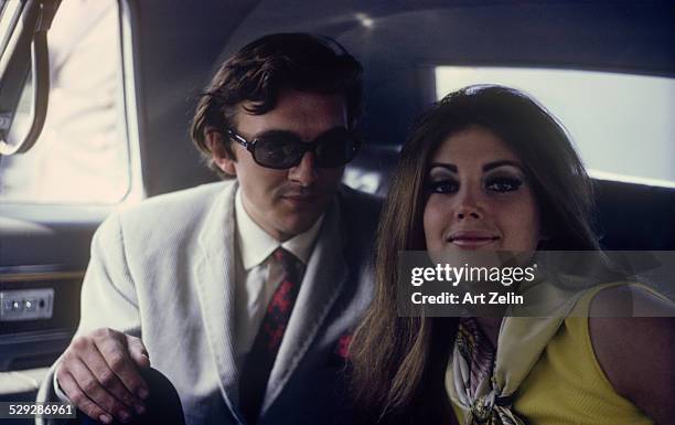 Gayle Hunnicutt with David Hemmings in a limousine; circa 1970; New York.