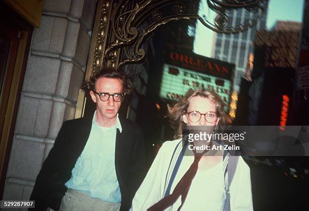 Mia Farrow with Woody Allen walking on the street; circa 1970; New York.