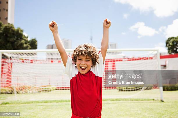 cheering soccer player - child arms raised stock pictures, royalty-free photos & images