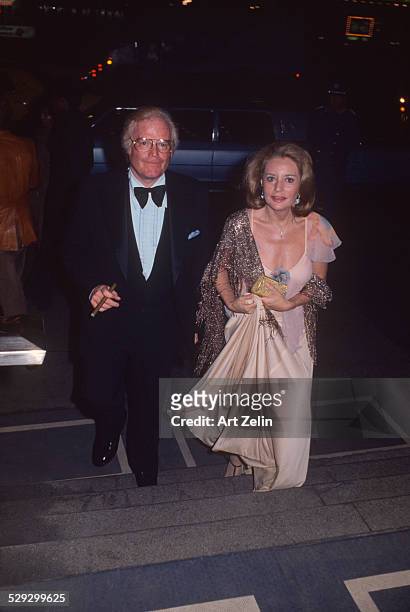 Barbara Walters with Roone Arledge going to their engagement party; circa 1970; New York.