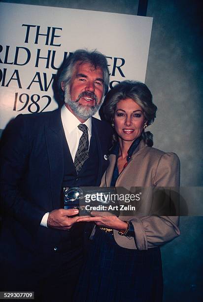 Marianne Gordon Rogers with her husband Kenny Rogers with The World Hunger Media Award 1980.