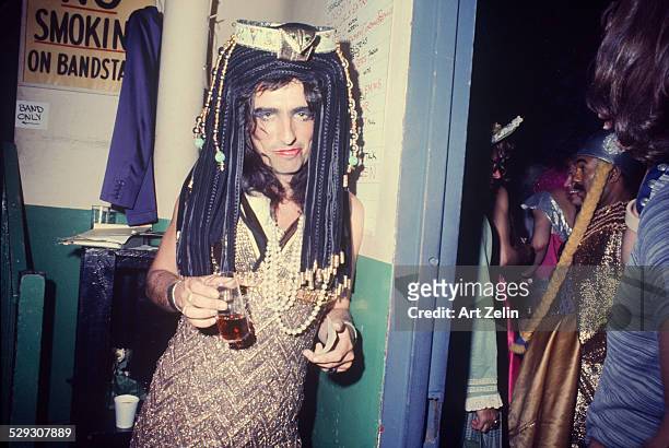 Alice Cooper dressed as Cleopatra at a party; circa 1970; New York.