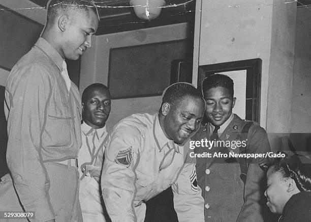 African-American soldiers and woman during a USO event during World War 2, September 19, 1942.