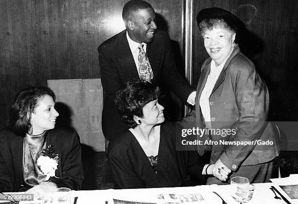 Entrepreneur Cathy Hughes, Developer and Politician H.R. Crawford , unknown woman and Civil Rights Activist Wilhelming Rolark, c.1980.