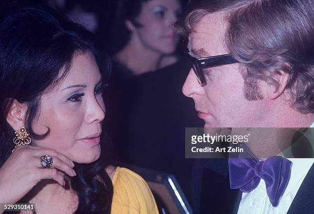 Michael Caine and Shakira, his wife, in conversation; circa 1970; New York.