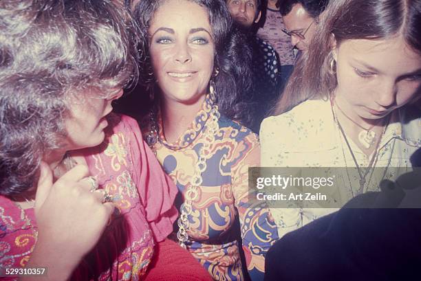 Lisa Todd Burton Elizabeth Taylor and Maria Bruton at a formal event; circa 1970; New York.