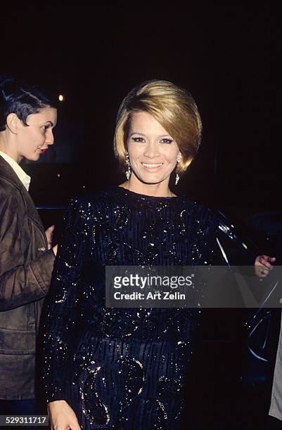 Angie Dickinson wearing a black beaded formal; circa 1970; New York.