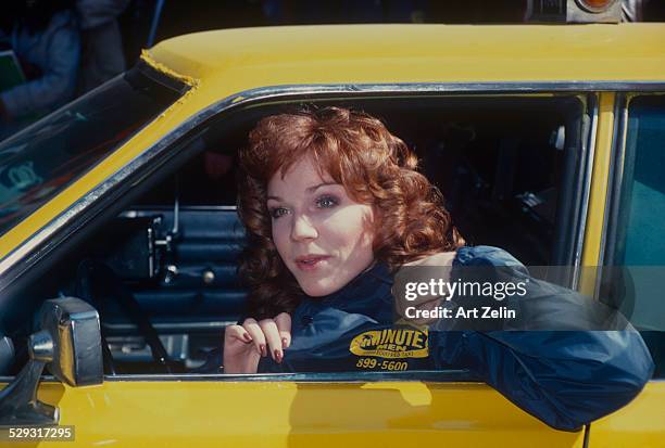 Marilu Henner in a taxi promoting the show Taxi"; circa 1970; New York.