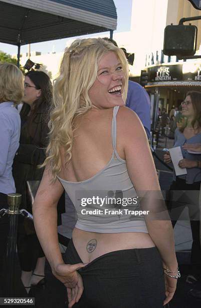 Actress Sarah Ann Morris displays her tattoos.