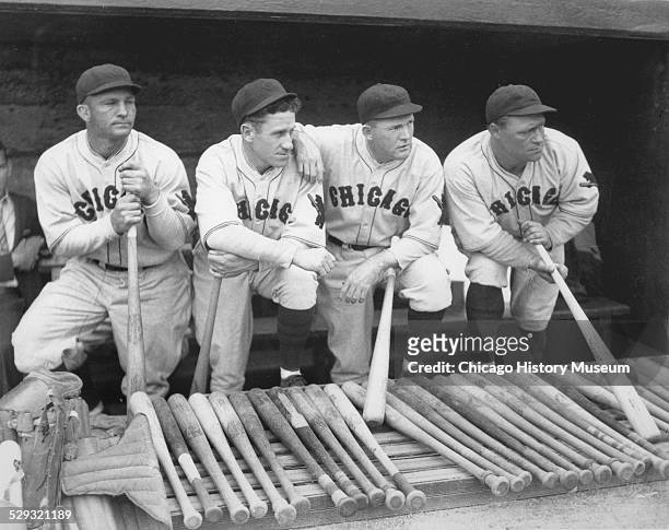 Baseball players Stephenson, Hazen Cuyler , Rogers Hornsby, and Hack Wilson of the National League's Chicago Cubs, standing in a dugout, probably at...